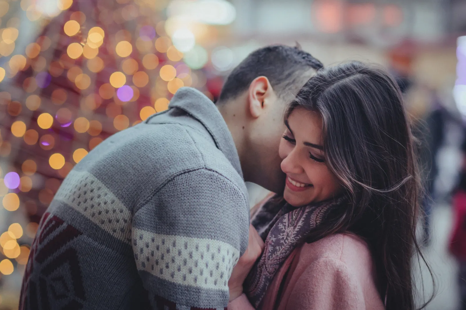 A couple relaxed and close together at home