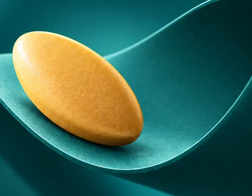 An amber oval tablet