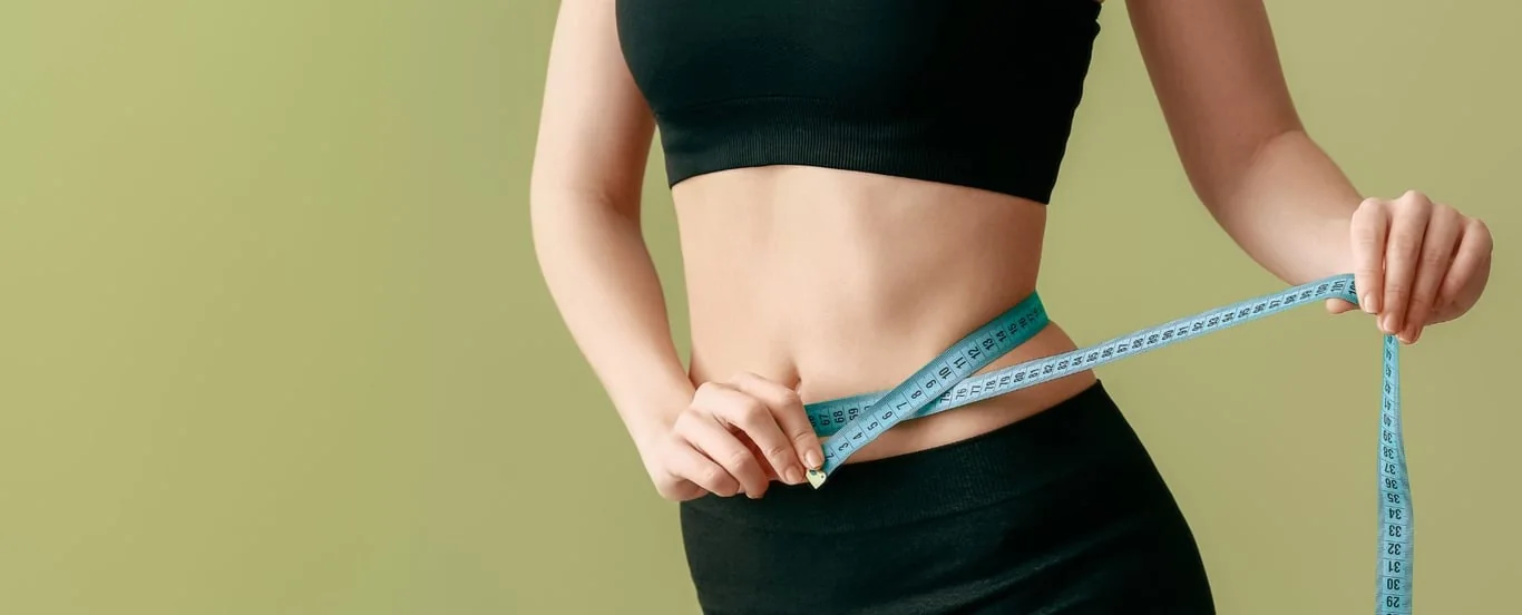 Someone measuring their waist